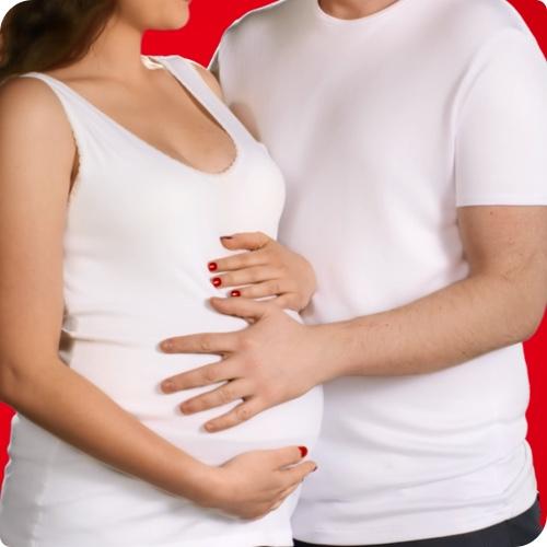 Man holding his hand on pregnant woman’s belly